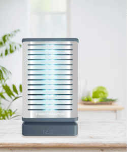 Désinsectiseur électrique compact à plaque de glu, posé sur une surface dans un environnement intérieur clair, idéal pour les cuisines ou les zones d'accueil.